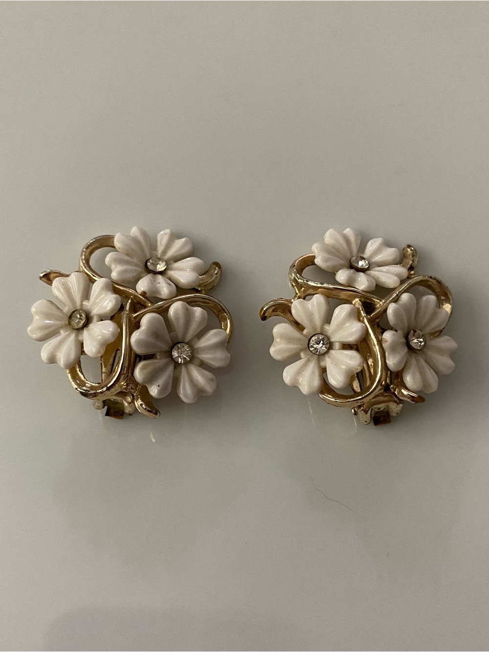 A pair of vintage Trifari gold-tone thermoplastic floral clip-on earrings.